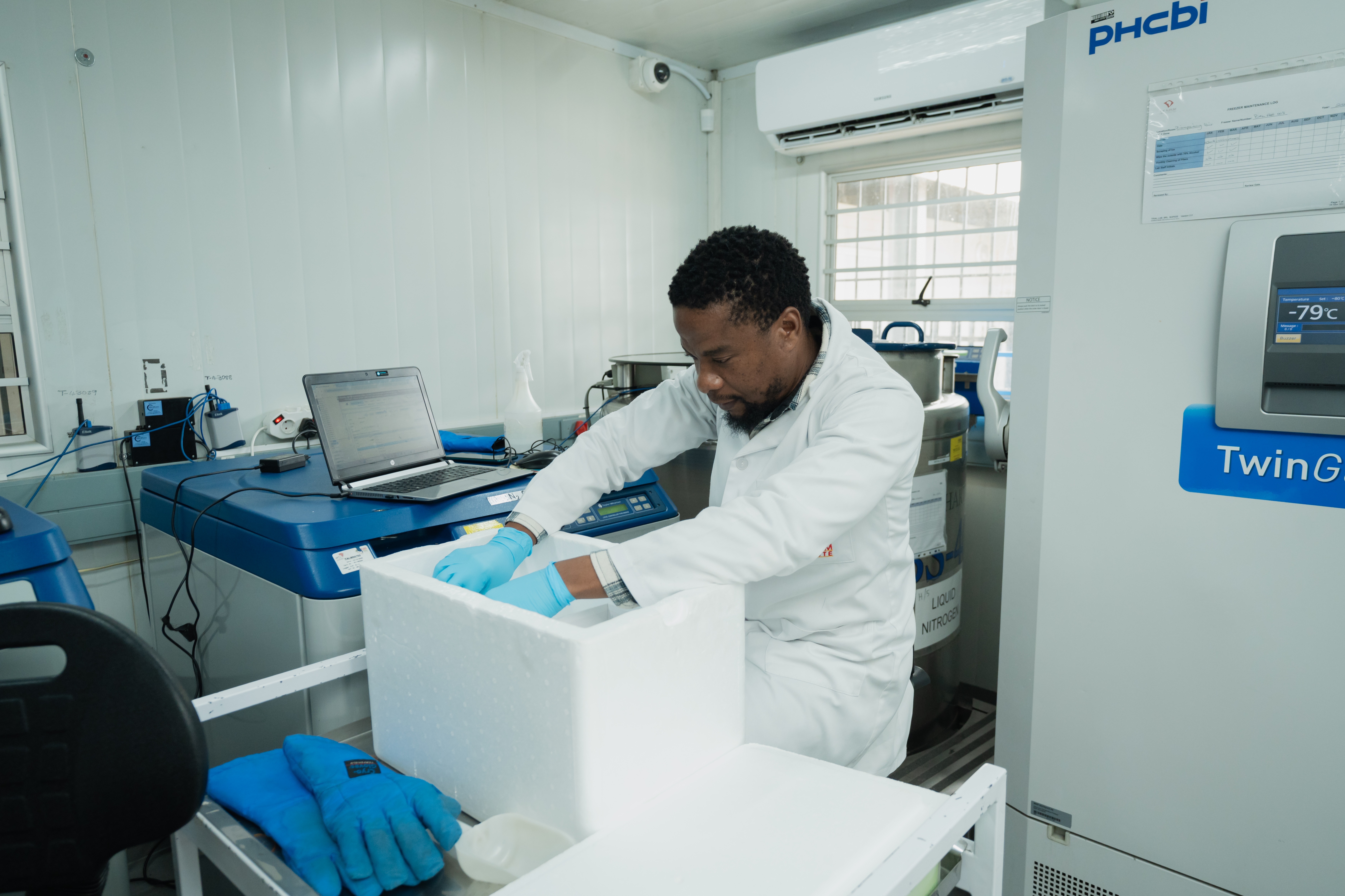 A laboratory staff member preparing research materials